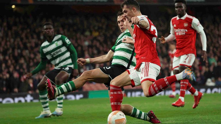 Ugarte attempts to block a cross by Granit Xhaka for Sporting against Arsenal