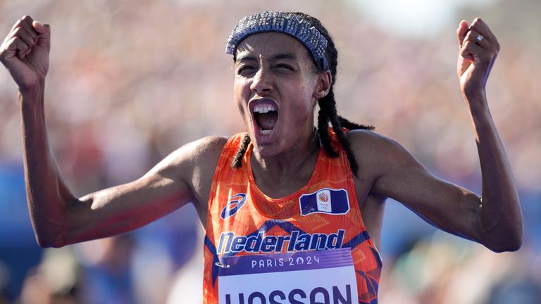 Sifan Hassan, of the Netherlands, celebrates after crossing the finish line to win the gold medal at the end of the women's marathon competition at the 2024 Summer Olympics, Sunday, Aug. 11, 2024, in Paris, France. (AP Photo/Vadim Ghirda)